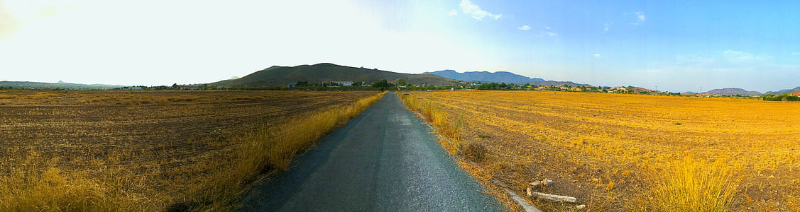 gray pathway under cloudy sky thumbnail