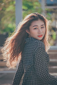 Closeup Photo of a Woman Wearing Black and White Plaid Blazer thumbnail