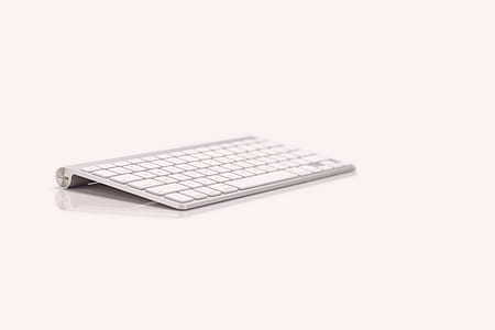 Apple Wireless Keyboard on white surface thumbnail