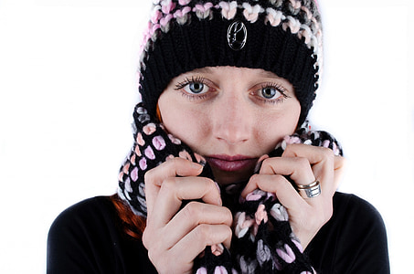 woman holding scarf near white background \ thumbnail