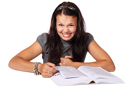 woman wearing gray top reading a book thumbnail