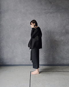 Woman in Black Gi Standing Beside Gray Wall thumbnail
