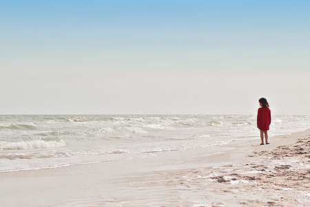 person standing on shore thumbnail