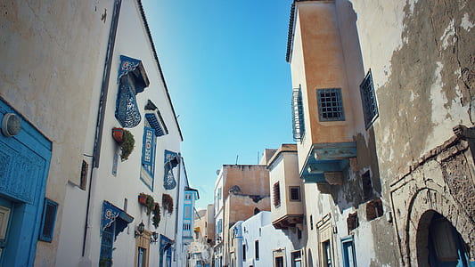 white concrete buildings under blue sky] thumbnail