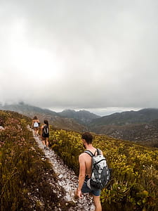 Man and Woman Hiking in Mountain thumbnail