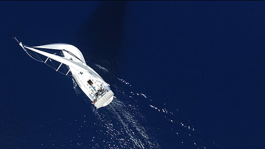white sailboat in body of water thumbnail