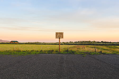 brown wooden basketball hoop and gray road thumbnail