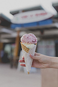 person holding ice cream cone thumbnail