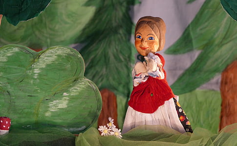 woman standing beside green tree figurine set thumbnail