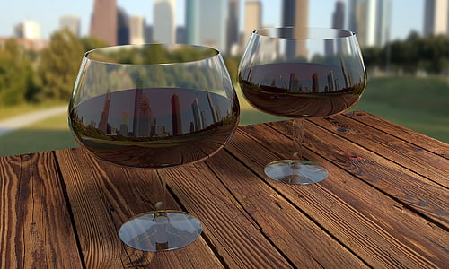 two wine glasses filled with wine on table thumbnail