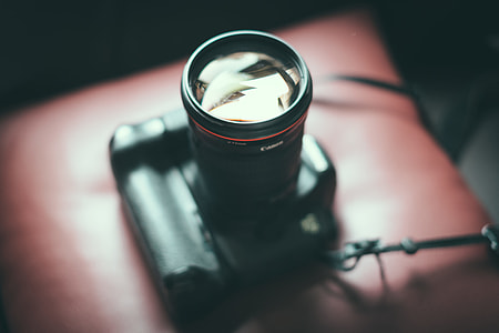 grayscale photography of black DSLR camera thumbnail