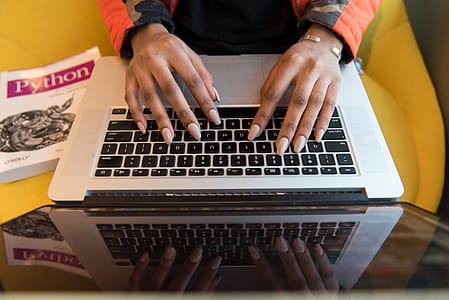 Person Typing On Macbook Pro thumbnail