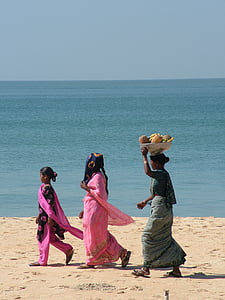 three women walking on beach sand thumbnail
