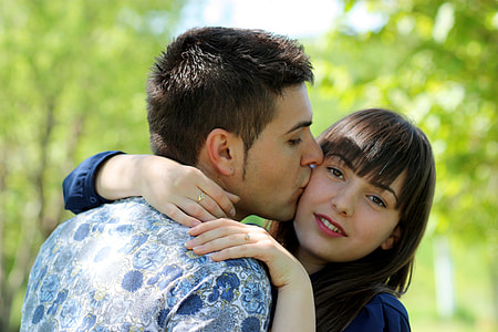 man kiss the chick of woman selected focus photography thumbnail
