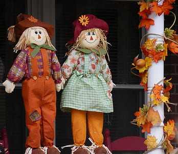two scarecrow plush toys on porch thumbnail