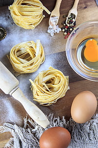 yellow noodles with eggs nearby thumbnail