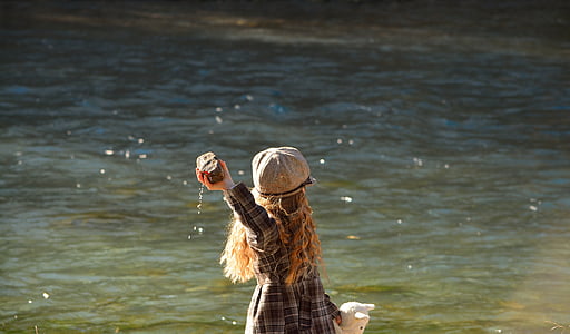 girl holding rock thumbnail