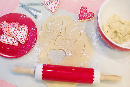 white and red bread roller on table-top beside bowl thumbnail