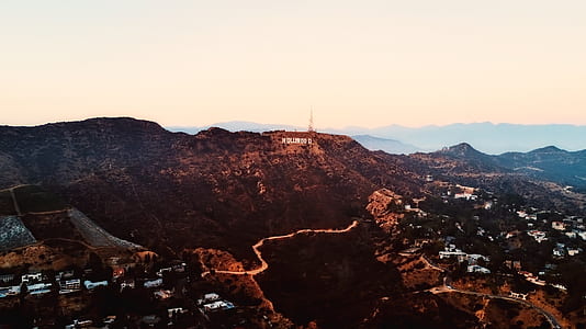 bird's-eye view photography of mountain and houses thumbnail