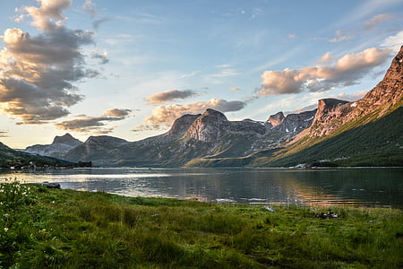 landscape photo of body of water near mountains thumbnail