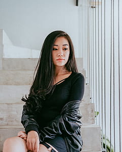 woman wearing a black top thumbnail