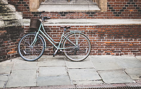 step-through bicycle lean parked on wall thumbnail