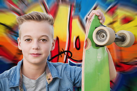 boy holding skateboard thumbnail