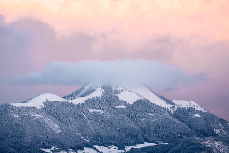 aerial photography of mountain under brown sky thumbnail