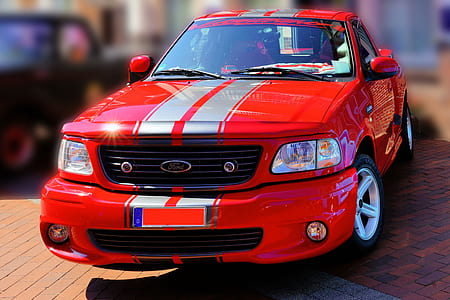 red and silver Ford F-150 single cab pickup truck thumbnail