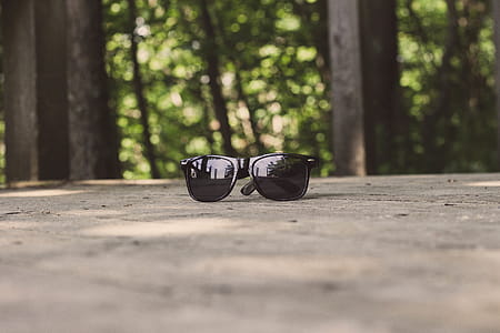 Shallow Focus Photography of Black Sunglasses thumbnail