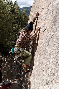 man climbing rock thumbnail