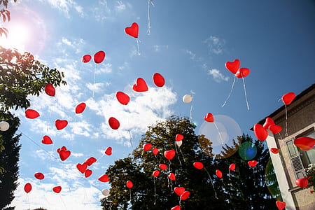 floating red heart balloons thumbnail