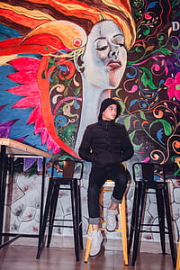 Person Leaning On Mural Painted Wall thumbnail