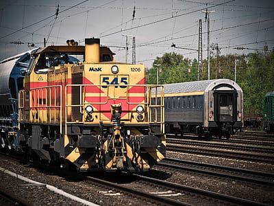 yellow and red train on rail thumbnail