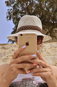 woman holding iPhone thumbnail