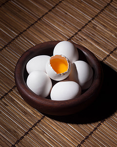 cracked egg on five eggs inside bowl thumbnail