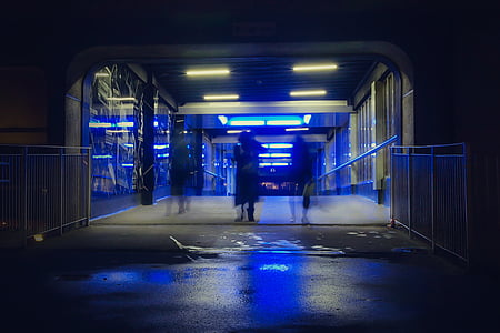 person walking on hallway at nighttime thumbnail