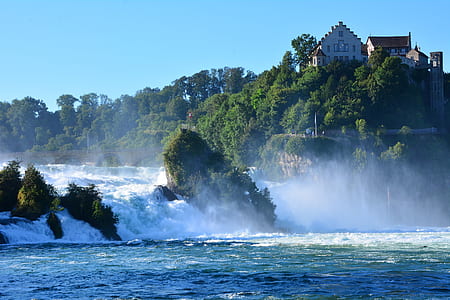 mansion on hill near waterfalls thumbnail