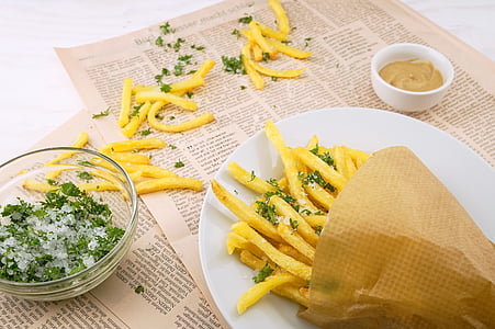 plate of French fries with dipping sauce thumbnail