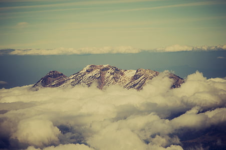 aerial photography of snow mountain surrounded by clouds thumbnail