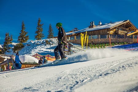 man riding ski blades while holding poles during daytime thumbnail