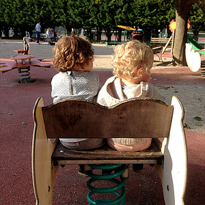 boy and girl sitting on bench thumbnail