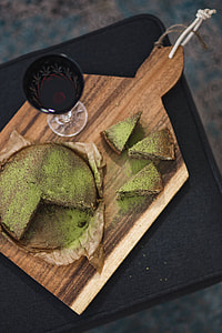 Delicious homemade matcha cake on a wooden board thumbnail