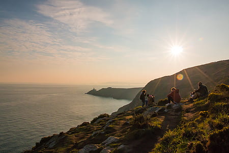 man and woman sitting on top of the mountain thumbnail