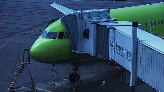 green airplane during daytime thumbnail