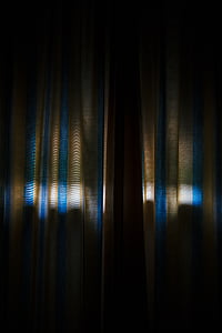 closed gray and blue curtain thumbnail