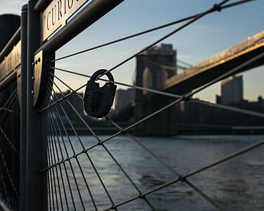 padlock on gray steel fence thumbnail