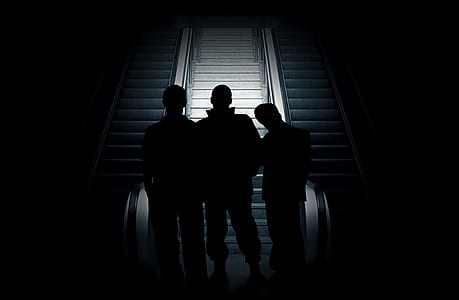 three silhouette of people thumbnail
