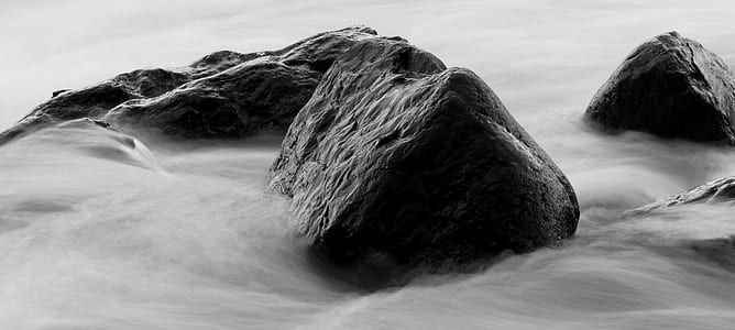 grayscale photo of rock formations thumbnail