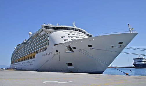 white cruise ship docked on pier thumbnail